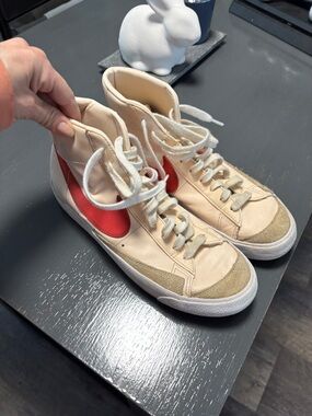 Nike Women's High-Top Sneakers in Cream with Red Swoosh